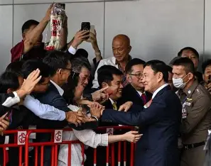 Thai abbot escapes justice. Former prime minister Thaksin Shinawatra welcomed by supporters after the Statute of Limitations made him a free man