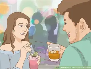 A couple toasting each other on a blind date