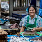 A Thai street vendor smiling