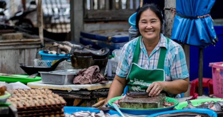 A Thai street vendor smiling