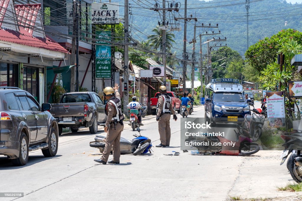Thai police attending a fatal accident. The biker was killed after a collision with a car