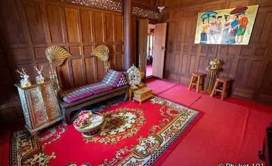 A typical Thai living room. Note the long sofa on the left.